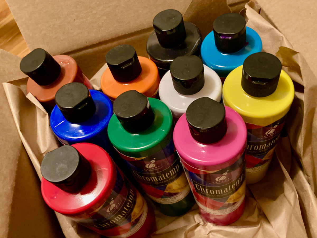 A Box of colorful paint bottles